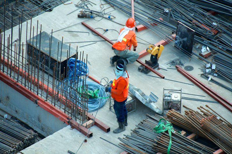 Home improvement specialist reviewing plans on site