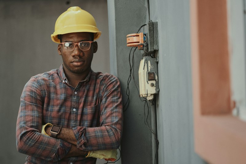 Smiling renovation professional in safety gear